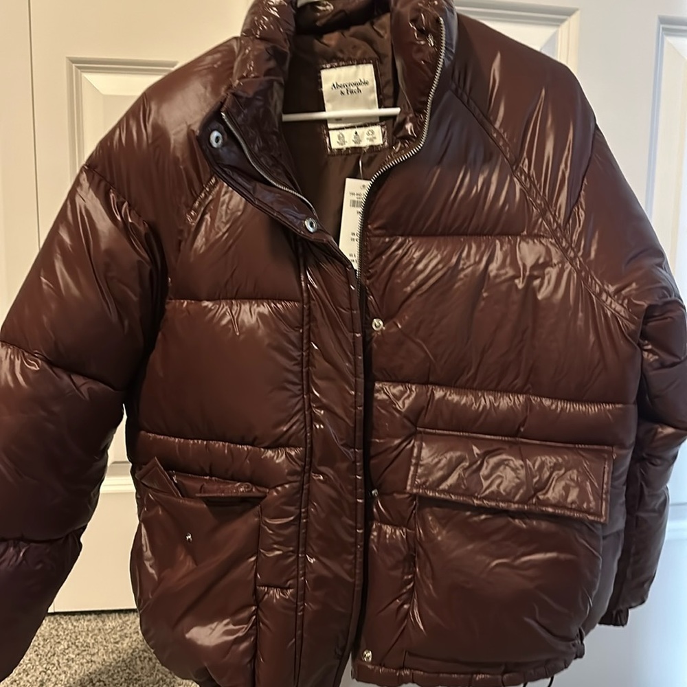 Brand New With Tags Abercrombie puffer. In color Dark Brown